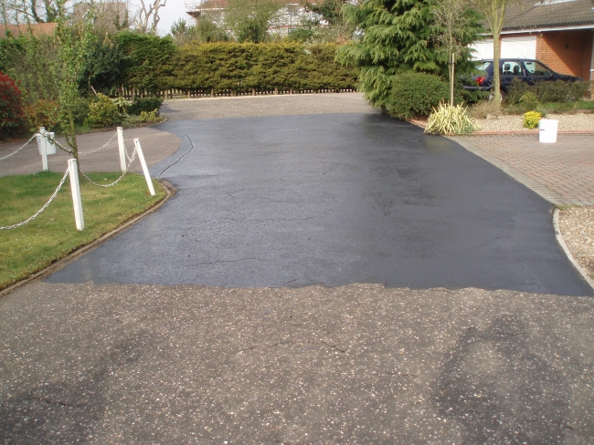 the two coat painting process will prolong the life of the tarmac