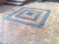 After cleaning the block paving, resanding and sealing the block paving looks like new.